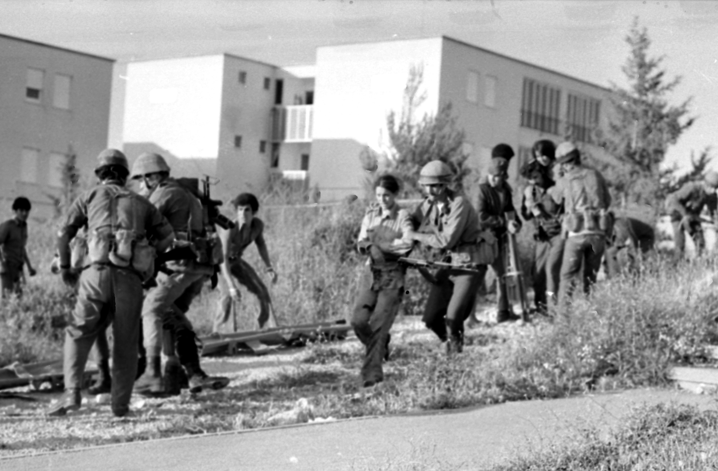 An Arab terrorist group attacked a school at Maalot killing several children and wounded thenth of them. IDF attacked the group killing the terrorists. Photo shows: Soldier rescue wounded children from the school 1974/05/15 Copyright © IPPA 09239-007-02 Photo by IPPA Staff